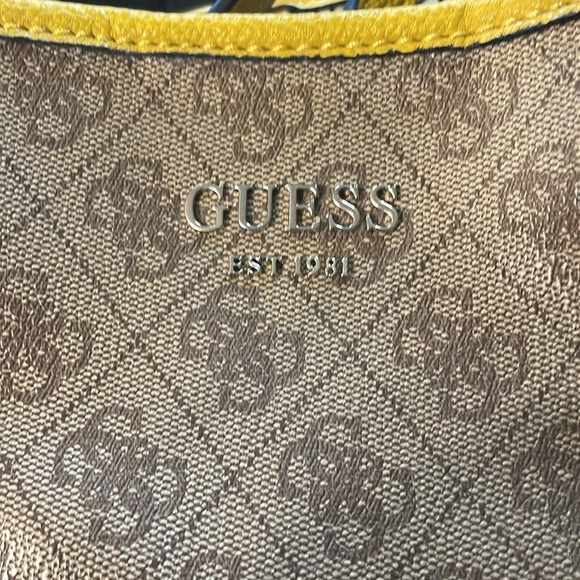 Guess purse with removable clutch inside. Clutch attaches inside with snaps - Picture 2 of 5